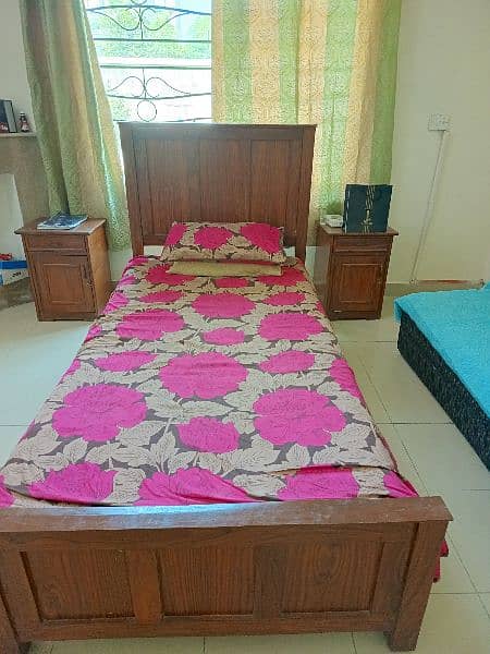 2 single beds without mattress with 2 side tables 1