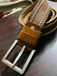 leather belt with metal buckle by cougar