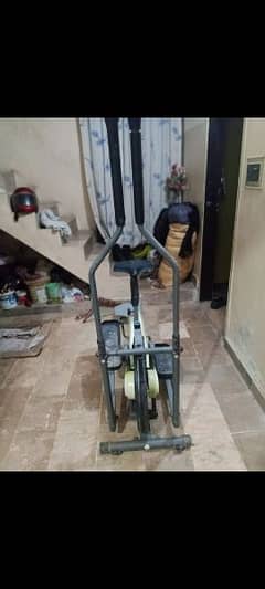 exercising elliptical cycling machine