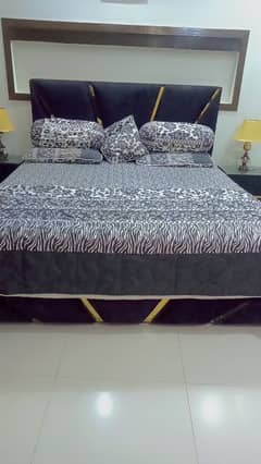 king bed set with two side tables and  dressing table .