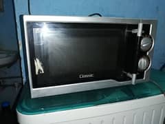 dawlance glass door microwave ovan used condition