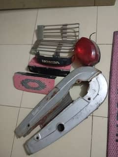 Honda 125 - Back Light, Chain cover , Foot rest, Honda Monogram