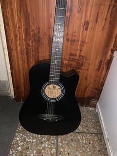 black guitar with bag , neat condition, excellent looking