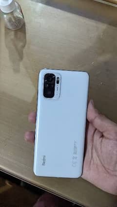 Redmi note 10 mobile 9/10. total genuine with box and charger