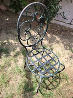 Heavy metal table with glass on top