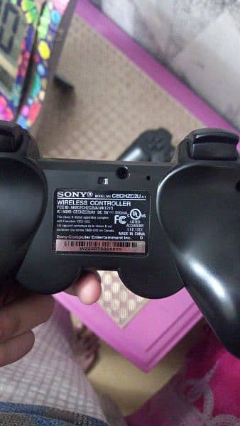 PS 3 Slim with 2 Controllers 6