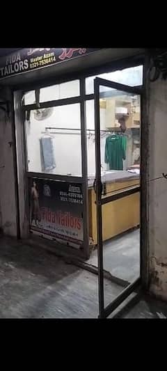 glass door with iron frame in good cndition urgent for sale03217536414