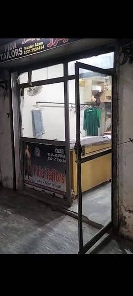 glass door with iron frame in good condition urgently for sale 0