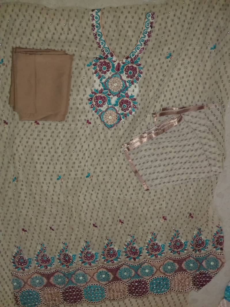 Unstitched ladies embroidy suits 4