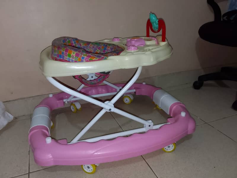 Baby Walker and a Play Mate just few month Used 2