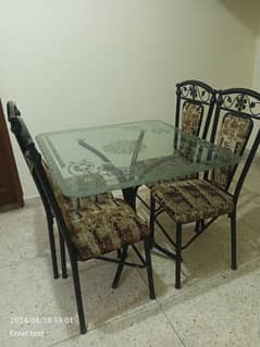 wrought iron table with glass top for 4 people