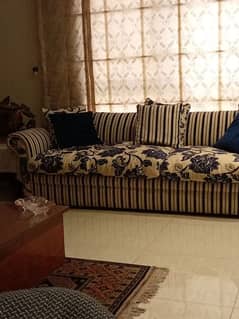 Beautiful Sofa in blue stripes and floral cushions