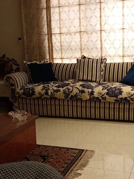 Beautiful Sofa in blue stripes and floral cushions 0