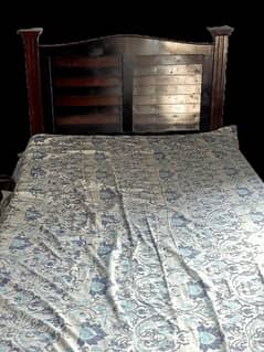 Single wooden bed with mattress