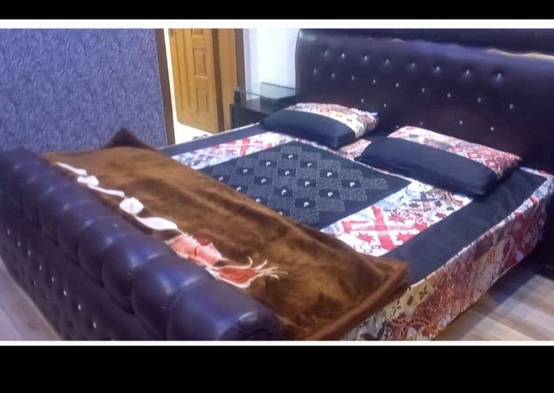 Leather double bed wd side tables 0