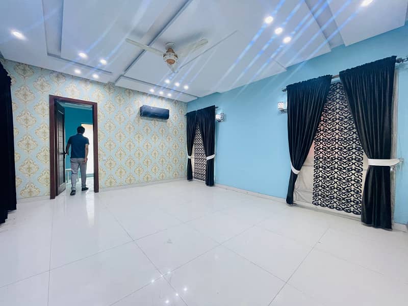 2 Kanal Facing Park Facing Canal Fully Furnished Triple Floor House with swimming pool, Mini Theater and Basement at the prime location of main Canal Road Babar Block, Bahria Town Lahore 18