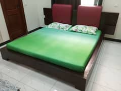 Bed with mattress and dressing table