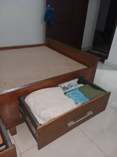 Single Bed.  With two side tables. Storage space drawers.