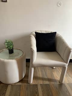 white leather chairs with table