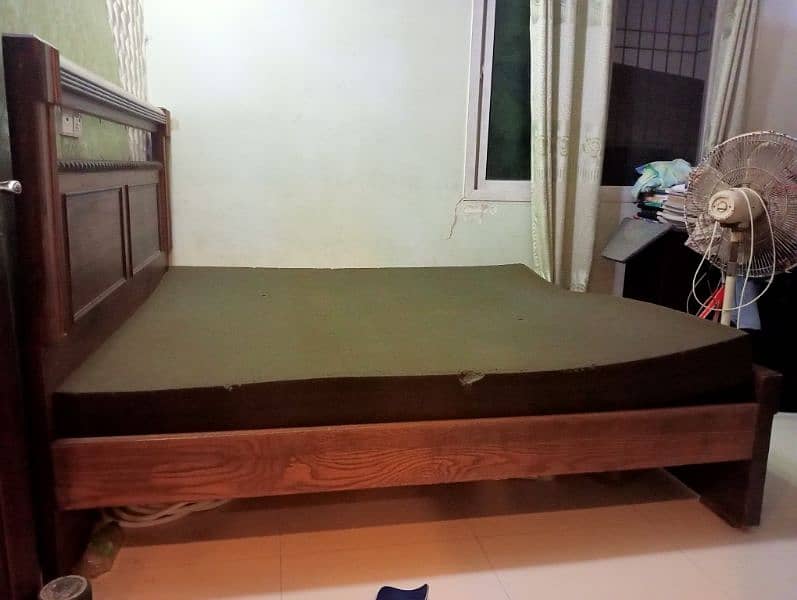 High-quality wooden queen-sized bed .  slight use. 5