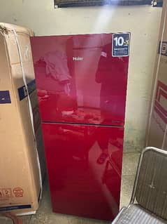 Haier 306hrf glass door in red colour with warranty card 10year