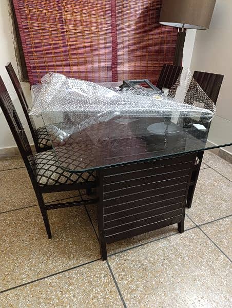 dinning table and 6 chairs with glass top 1