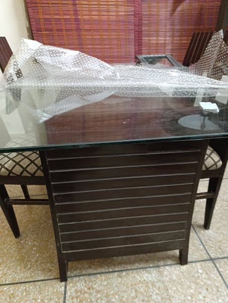 dinning table and 6 chairs with glass top 2