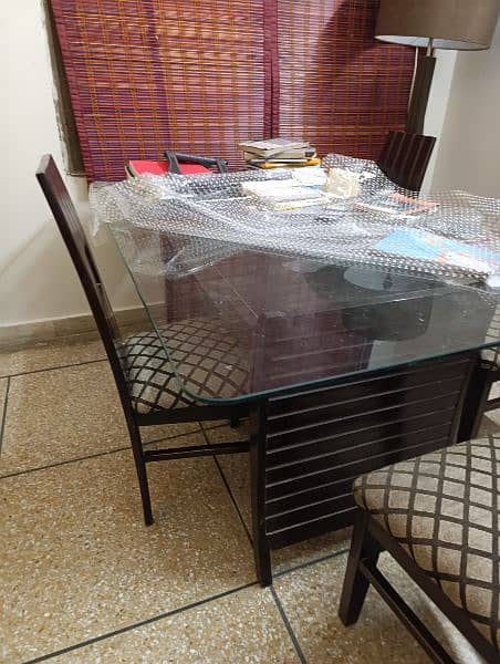 dinning table and 6 chairs with glass top 4