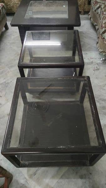 2 glass top tables with wheels 4