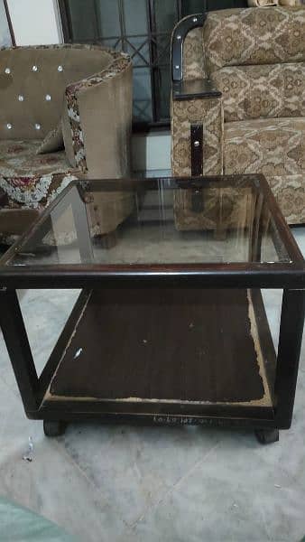 2 glass top tables with wheels 5