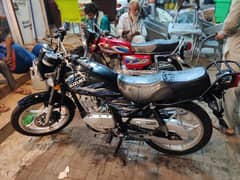 Suzuki GS 150 with rims.