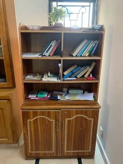 Books cupboard and a little Clothes section