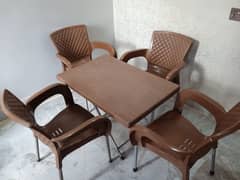 4 plastic chairs and 1 folding table 0