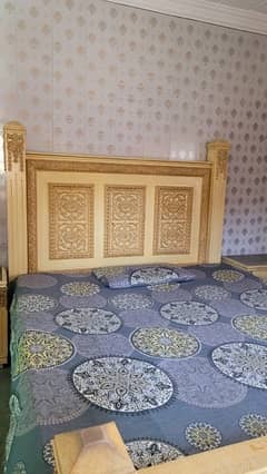 king-size bed with side tables and dressing