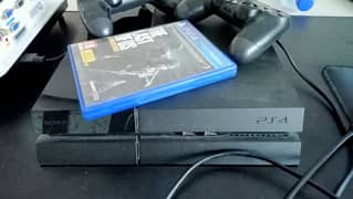 PS4 fat with two controllers and two games