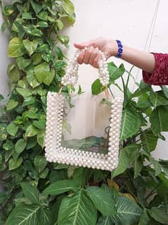 hand made pearl bag with ecralyic sheet