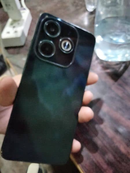 Infinix hot 40i 8+8 128 10 bay 10 condition 4