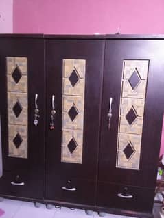 wooden bed set and cupboard 0