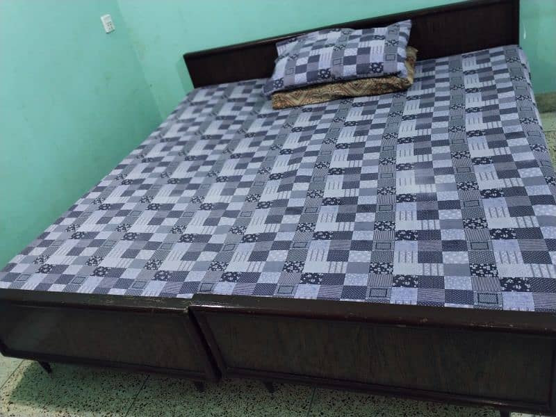 2 wooden single beds with hardboard & mattresses, all for 20,000. 0