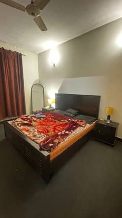 King sized bed with mattress and side tables