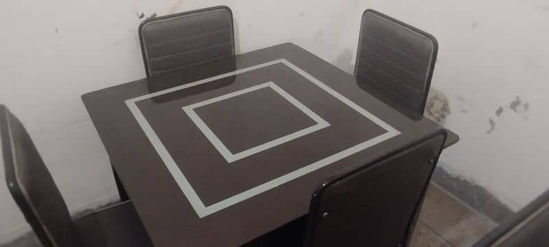 2 glass dinning tables with 8 chairs 0