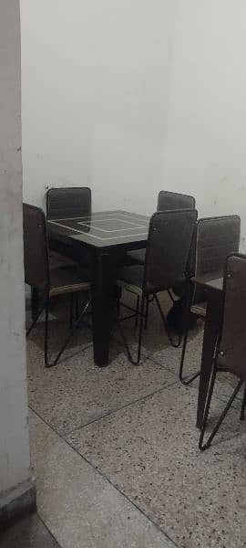 2 glass dinning tables with 8 chairs 4