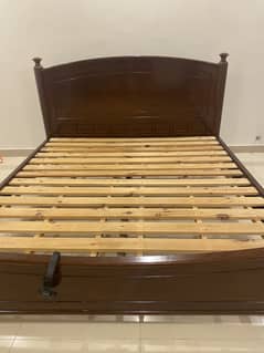 Wooden double bed with mattress