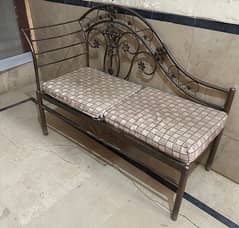 iron dewan with cushions.