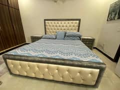 king size bed with sidetables and big dressing table