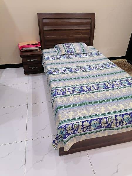 Single bed with side table 0