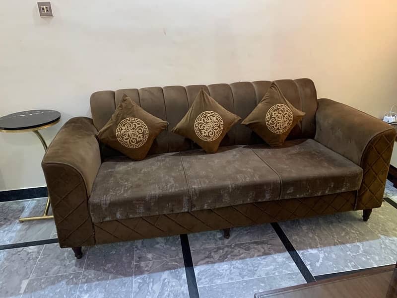 5 seater premium sofa set in brown colour a big square table 2