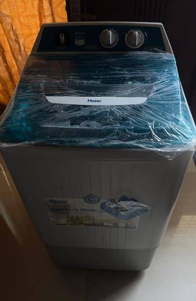 washing machine/ Haier Original 12 kg washing machine and dryer . 0