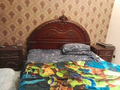 double bed and dressing with room chairs