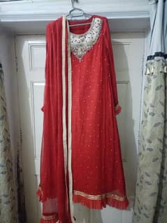 Red color embroidered frock in new condition